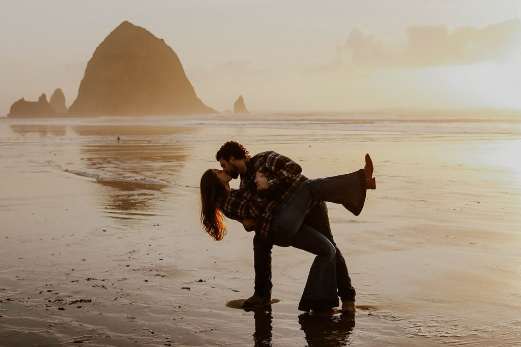 Hannah and Coleton taking a romantic photo on the Oregon Coast for their Cannon Beach engagement photos