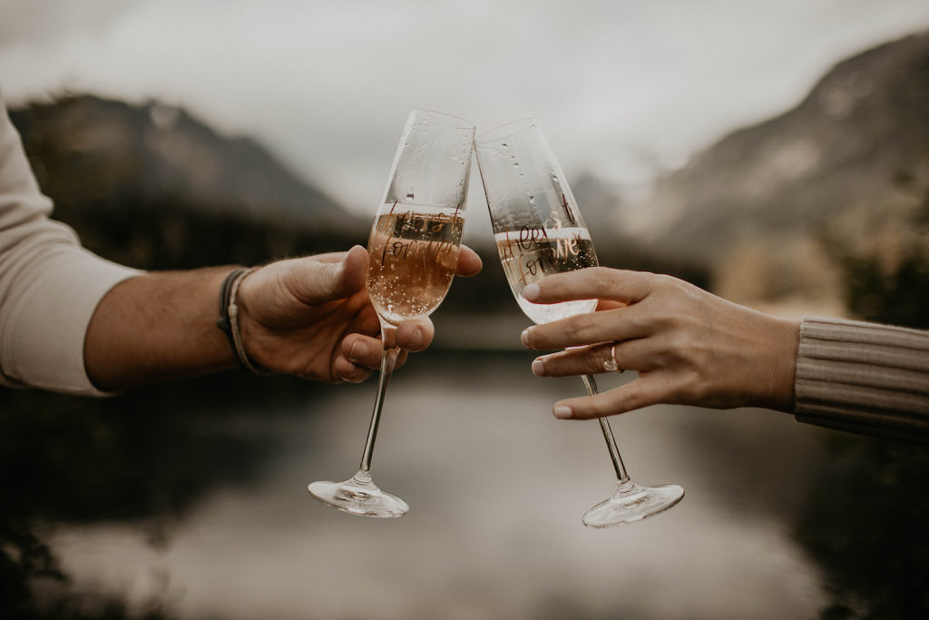 Cheers to forever champagne flutes, cheers during engagement photos
