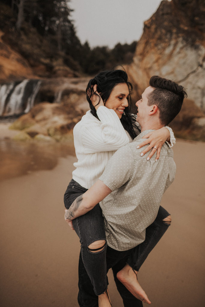 beach-engagement-waterfall-in-background