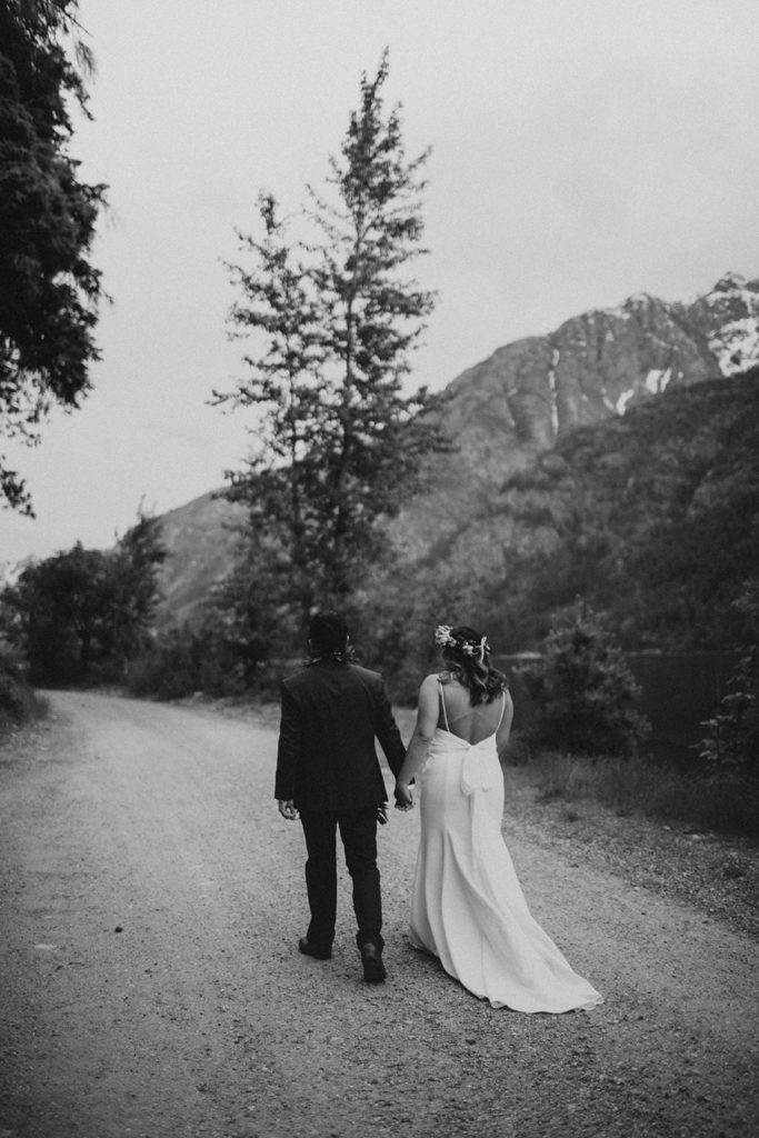 national park elopement bride and groom walking hand in hand