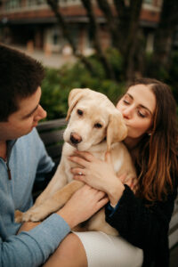 Preparing for Your Engagement Session with a puppy, engagement photo with two people and their golden lab puppy 
