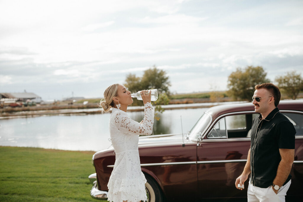 Bride drinking tequila before engagement session on family property in Royal City, WA