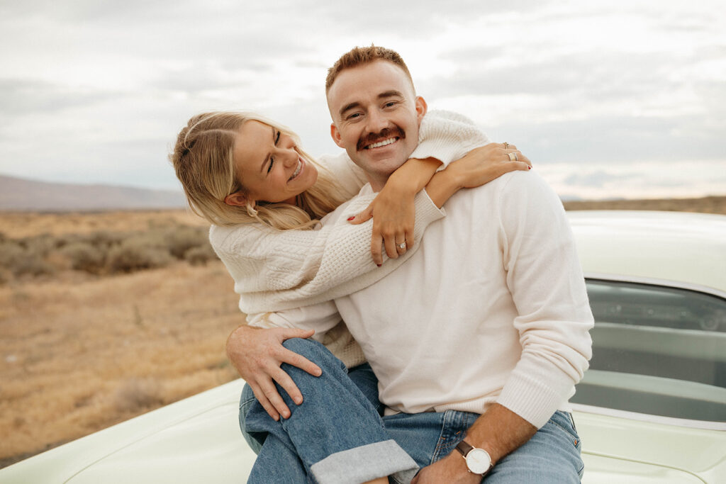 Engagement session couples portrait on the back of a vintage car Royal City, WA.