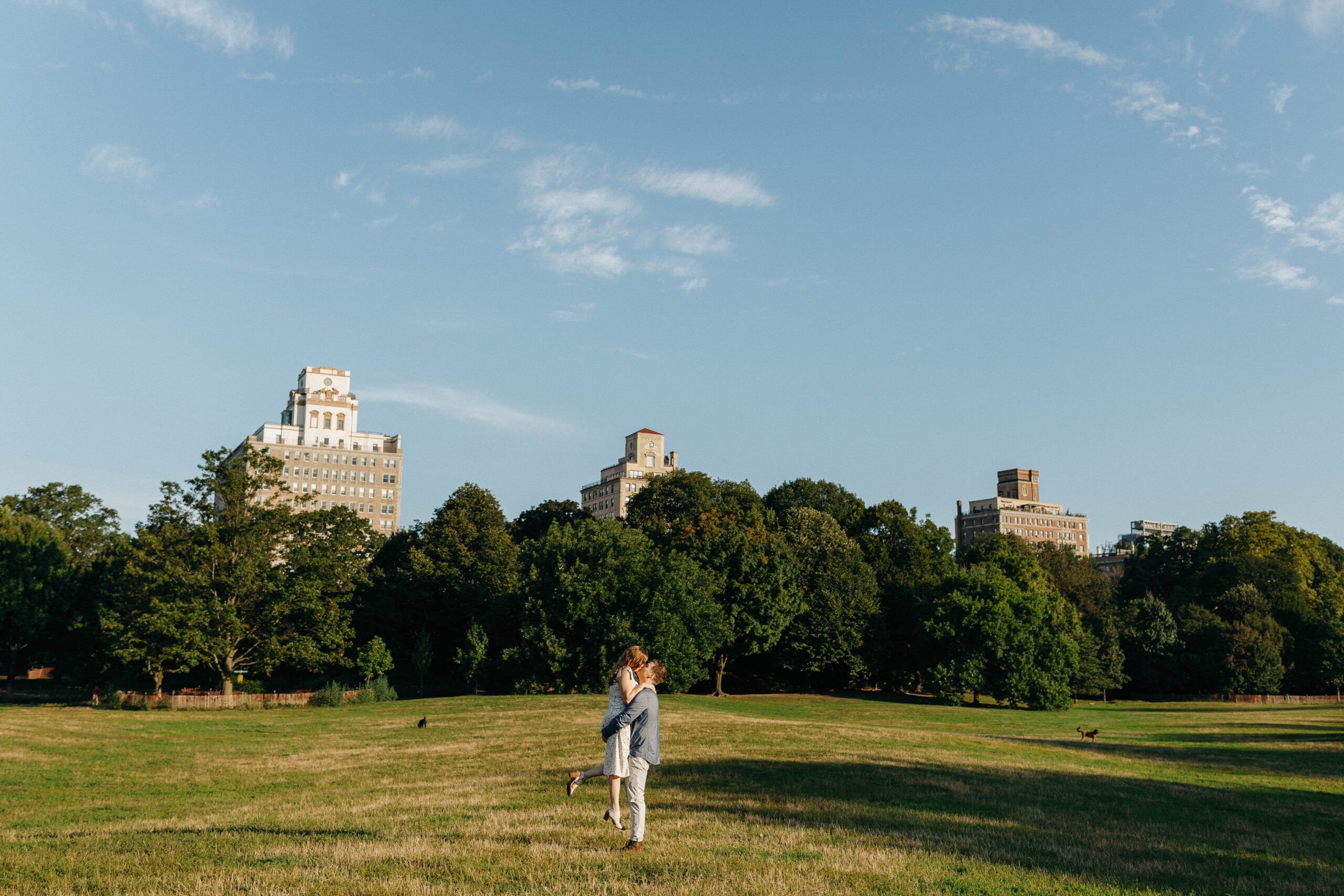 couple embracing in Brooklyn, ny for their engagement session at sunrise